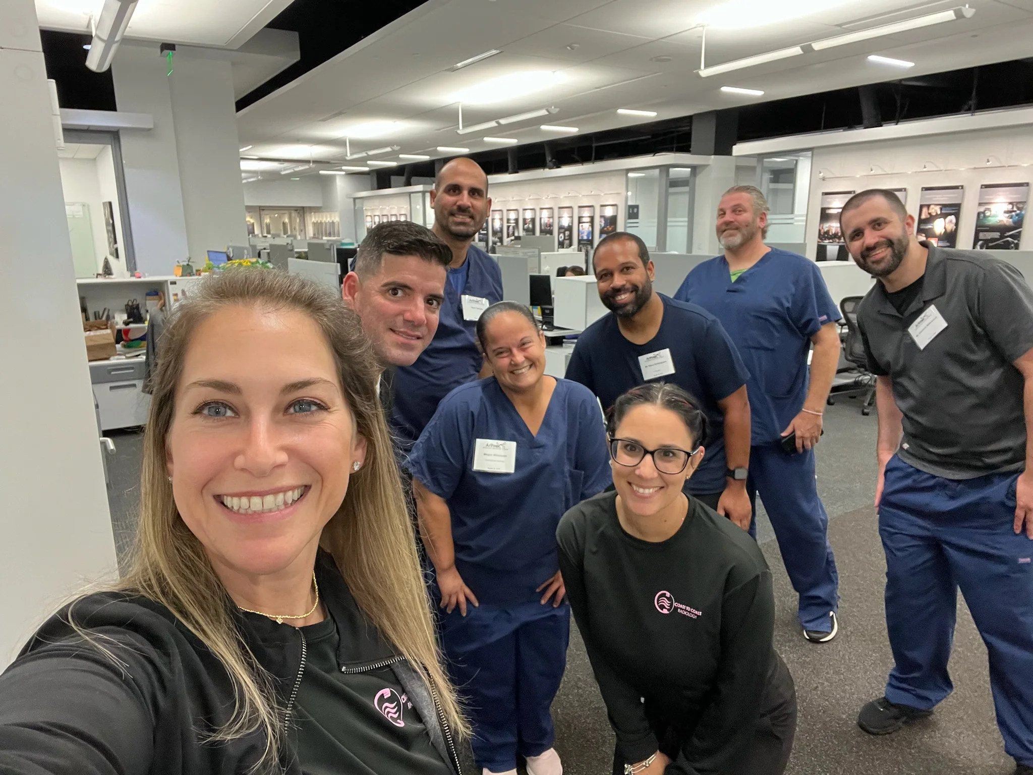 Coast To Coast Radiology team members taking a group selfie in the office By Coast To Coast Radiology