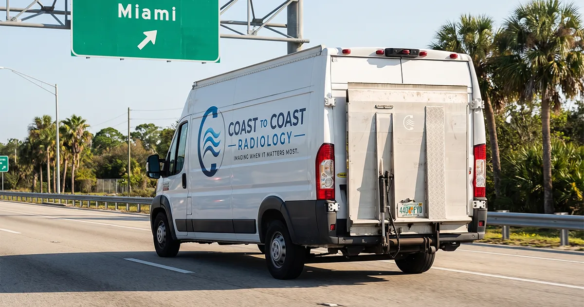 Coast to Coast Radiology delivery van on the highway heading into Miami, FL