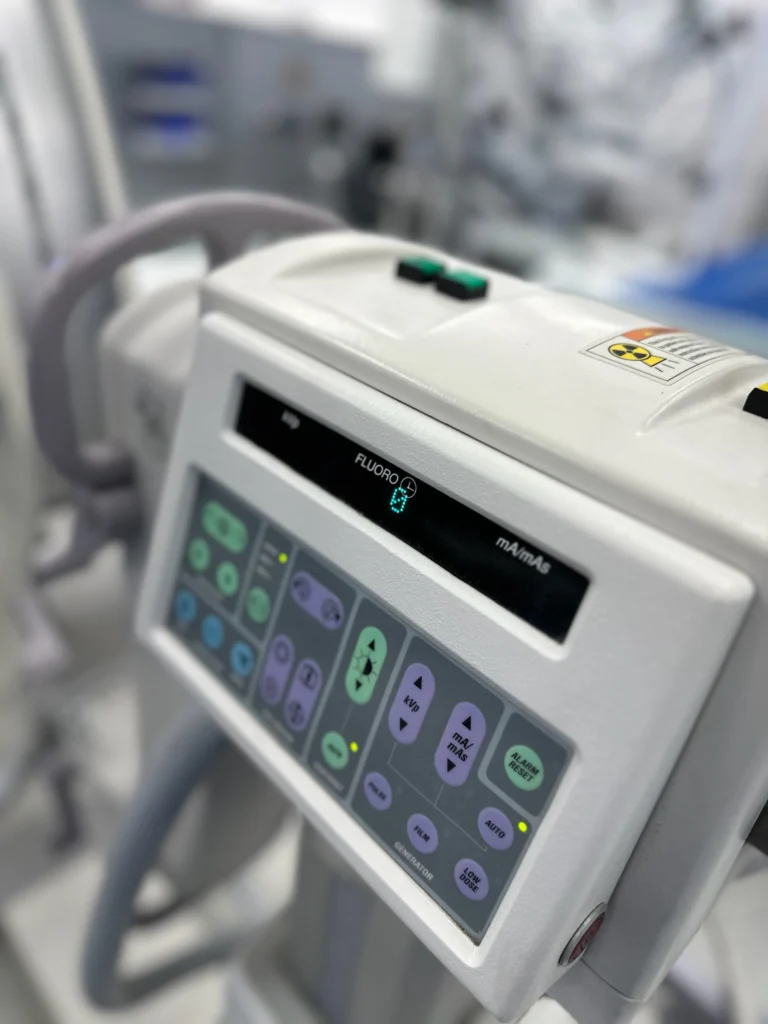 Close-up of C-Arm machine control panel display with fluoroscopy settings By Coast To Coast Radiology