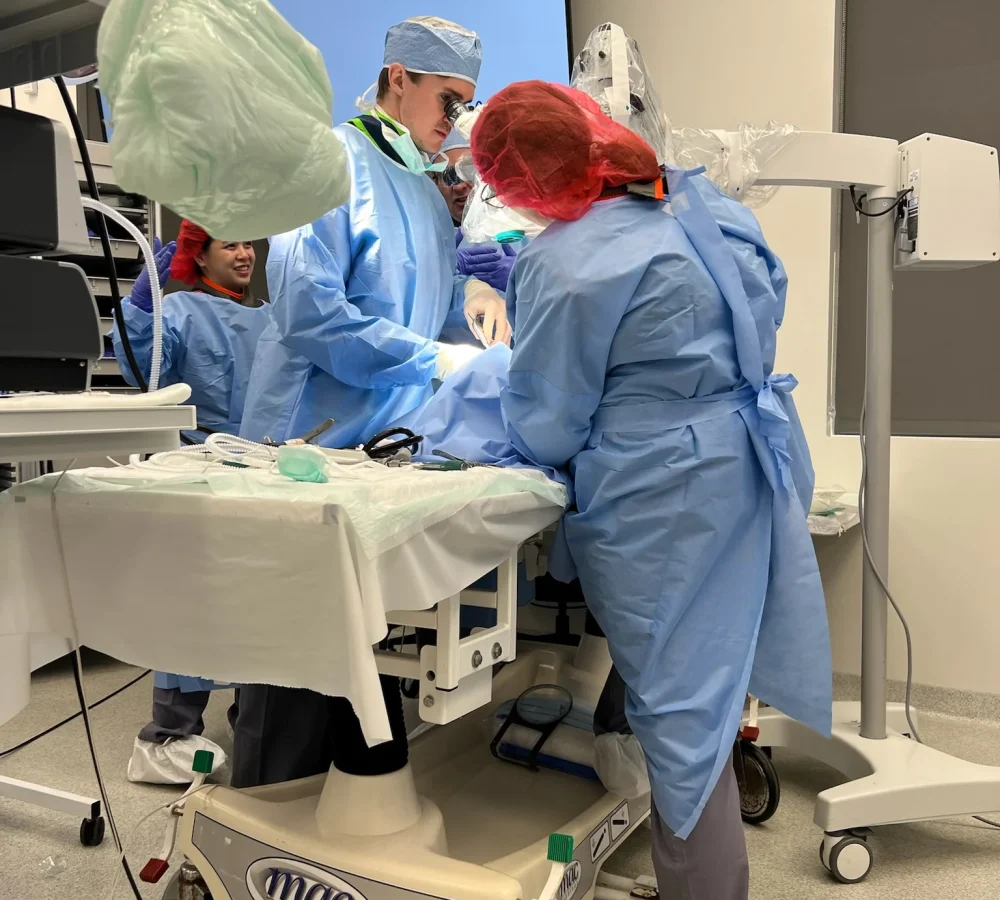 Coast to Coast Radiology professionals working alongside surgical staff during a live procedure in Florida.