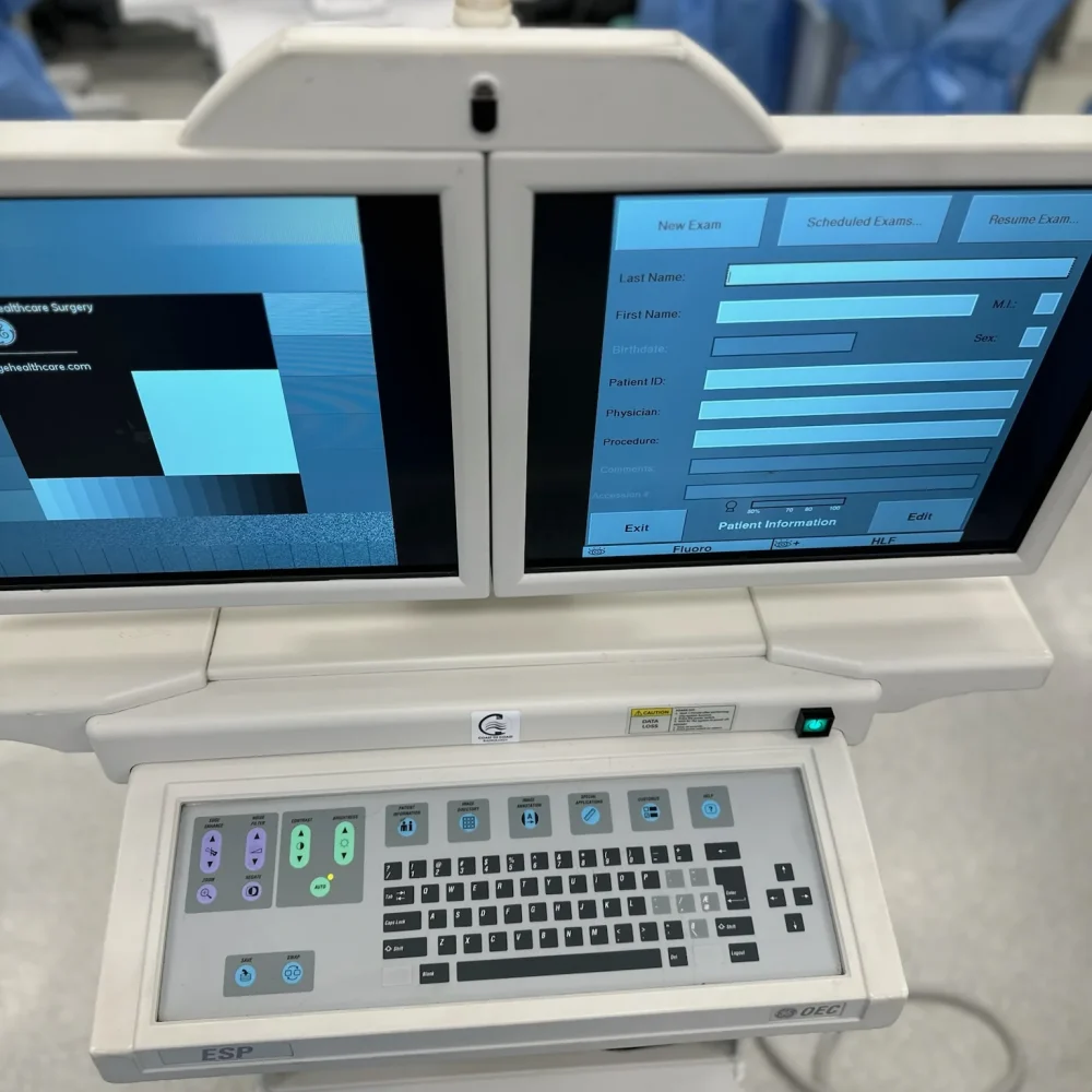 Coast to Coast Radiology technician adjusting a GE OEC C-Arm inside a Florida operating room to ensure proper positioning and imaging readiness.